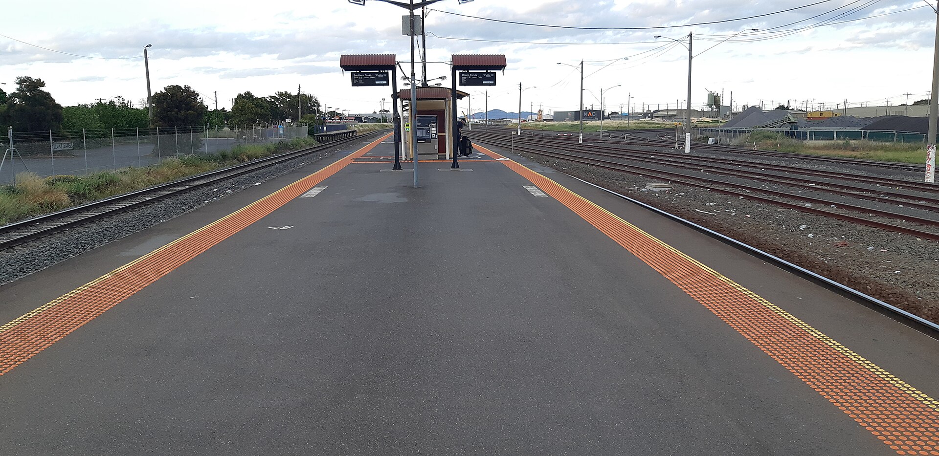 The island platform at North Shore station, with the next trains to Southern Cross and Waurn Ponds on the screens.