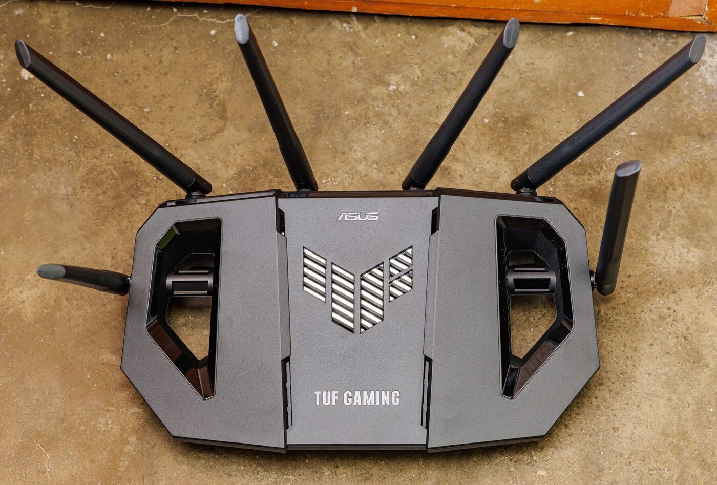 An ASUS TUF gaming WiFi router with multiple external antennas