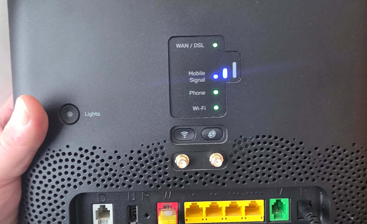 The back of a home modem showing its labelled connection indicator lights
