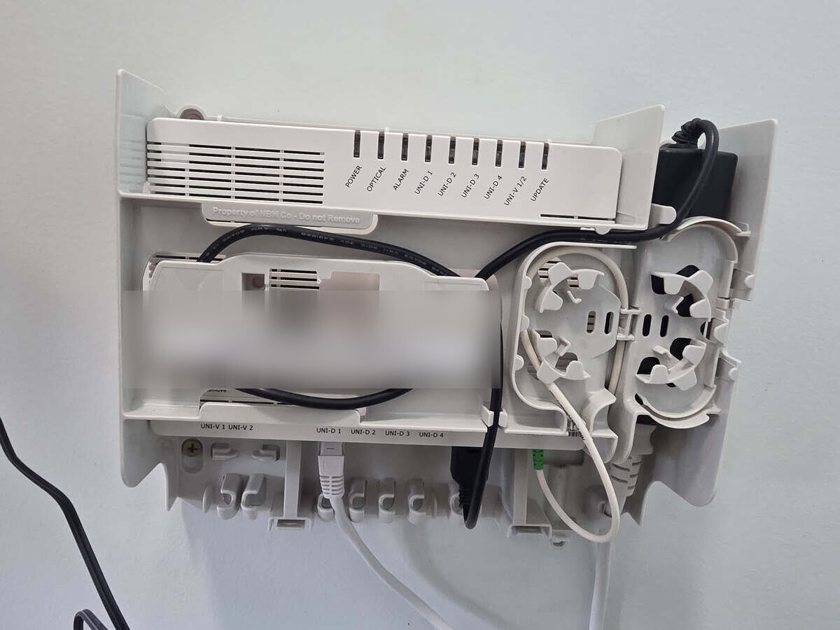 An NBN fibre connection box (FTTP NTD) showing its labelled UNI-D data ports